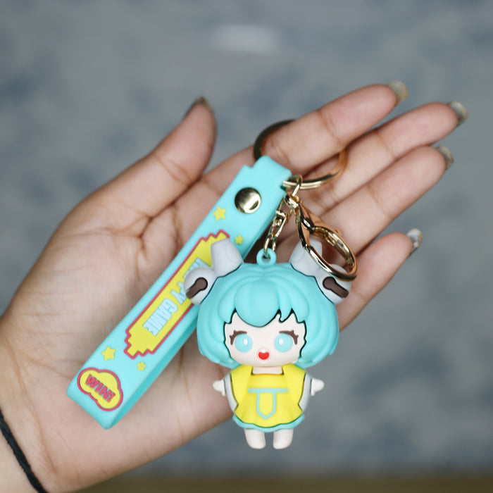 Power Girl Cartoon style keychain with band ( yellow and green)