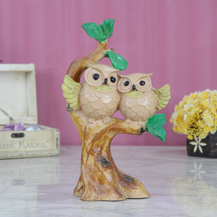 Wonderland two happy owl on Tree Branch