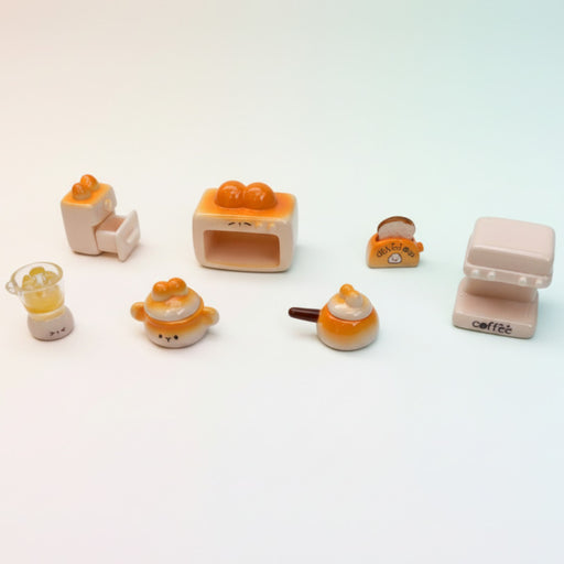 Five brown miniature dollhouse bookshelves and cabinets arranged in a row, featuring a gold candelabra and a tiny book accessory.