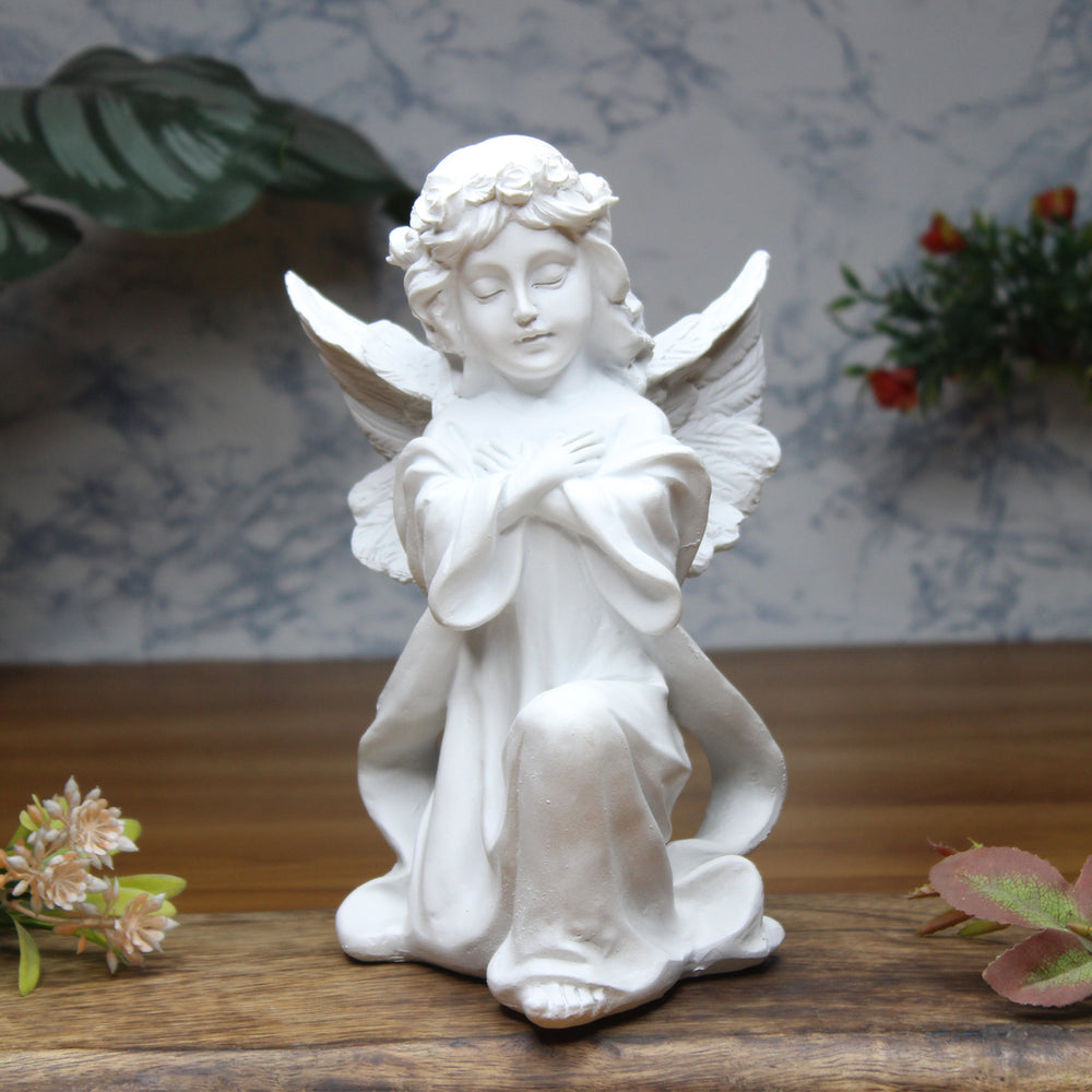 Angel big wings hand on heart, table decoration, home décor