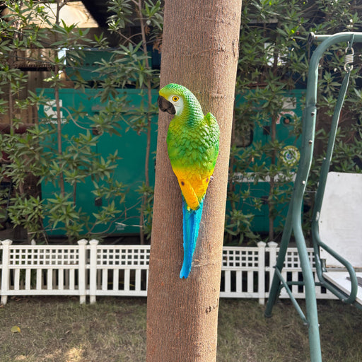 "Hand-painted colorful resin parrot figurine for tropical garden decor, perched on a branch as a realistic outdoor bird statue and home wall art decoration."