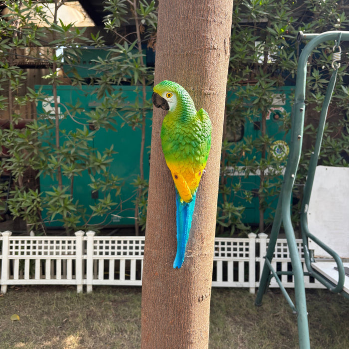 "Hand-painted colorful resin parrot figurine for tropical garden decor, perched on a branch as a realistic outdoor bird statue and home wall art decoration."