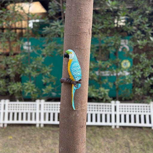 Vibrant blue and yellow macaw parrot wall decor for outdoor garden and home patio.