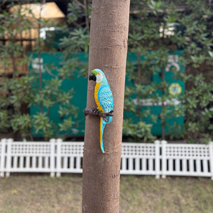 Vibrant blue and yellow macaw parrot wall decor for outdoor garden and home patio.