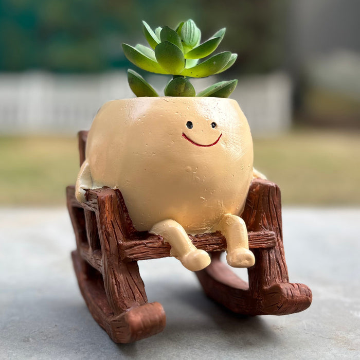 Decorative mini resin succulent pot featuring a happy face character on a rocking chair, ideal for office desk or home decor.
