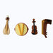 Miniature collection of four traditional musical instruments: a light brown stringed lute (like an oud or setar), a small brown violin/fiddle, a red and cream hand drum, and a dark brown two-stringed spike fiddle (like an erhu or rabab).