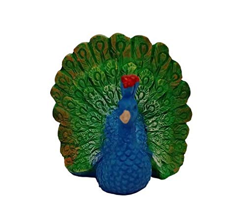 A miniature resin peacock figurine with a bright blue body and a red crest. The peacock has its large green and gold tail feathers spread open in a fan shape, shown against a plain white background.