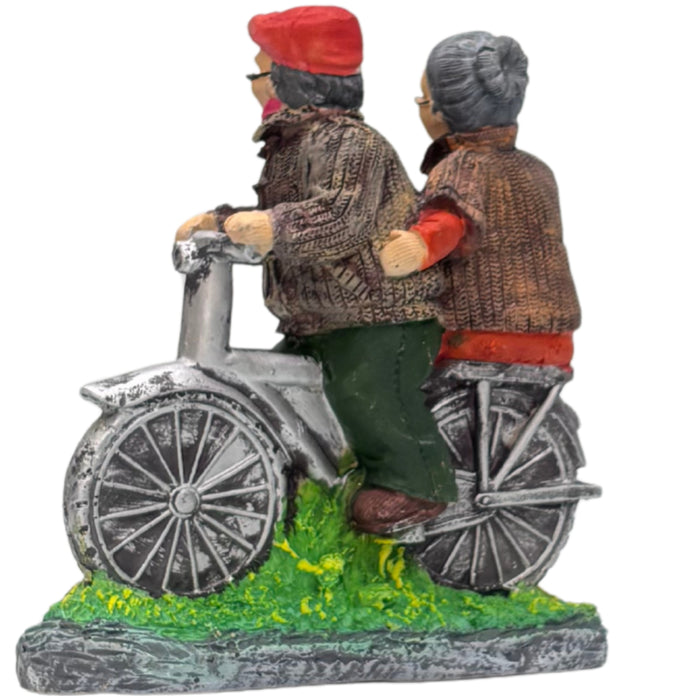 Wonderland Hand-Painted Grandparents on Bicycle Figurine – Sweet Elderly Couple Anniversary Statue – Whimsical Home Decor Tabletop Ornament