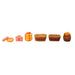 Six miniature resin figurines including orange fruit snacks, pink rings, a yellow gift bundle, two rectangular woven baskets with red banners, and a round basket filled with oranges, isolated on a white background.