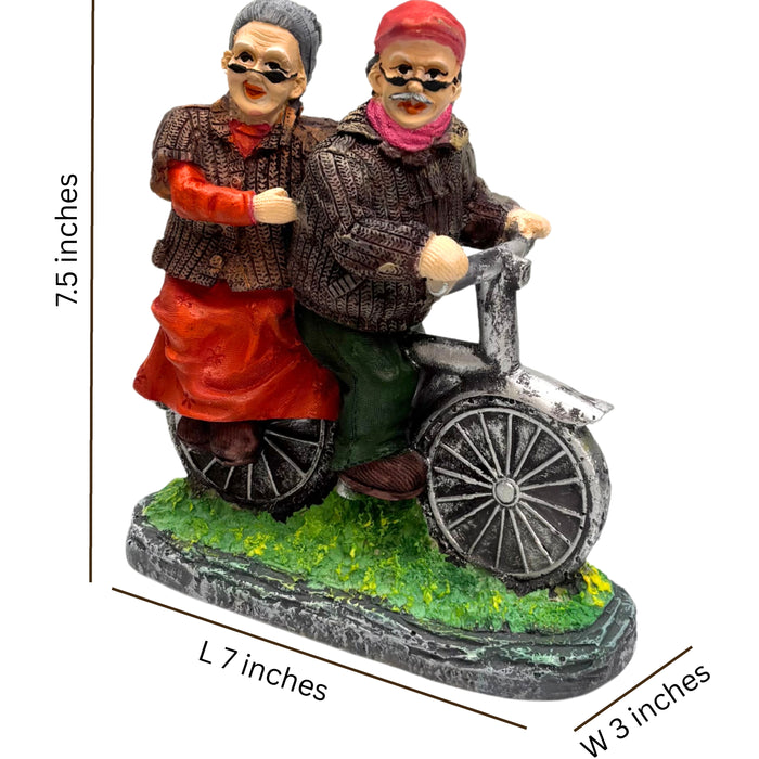 Wonderland Hand-Painted Grandparents on Bicycle Figurine – Sweet Elderly Couple Anniversary Statue – Whimsical Home Decor Tabletop Ornament