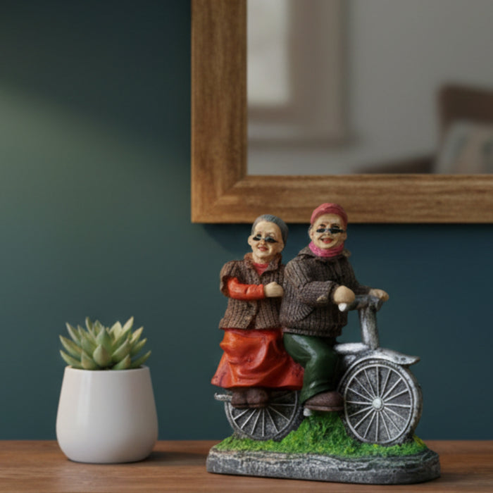Wonderland Hand-Painted Grandparents on Bicycle Figurine – Sweet Elderly Couple Anniversary Statue – Whimsical Home Decor Tabletop Ornament