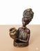 Afrocentric decorative lady statue, black and gold ethnic woman figurine for living room table centerpiece.