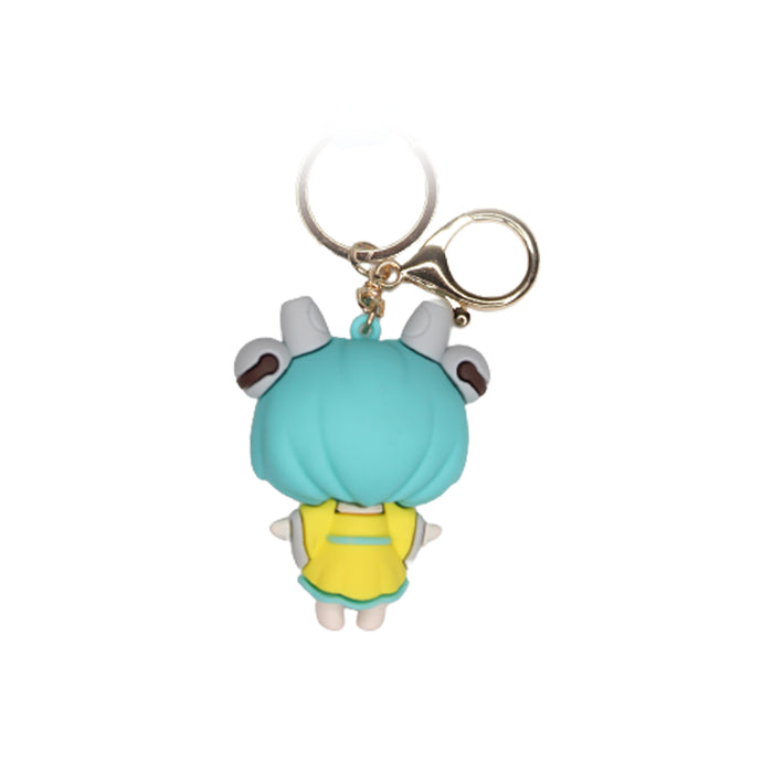 Power Girl Cartoon style keychain with band ( yellow and green)