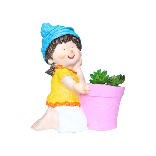 A miniature resin figurine of a smiling girl with a blue hat and yellow shirt kneeling next to a small pink flower pot containing two green succulents.