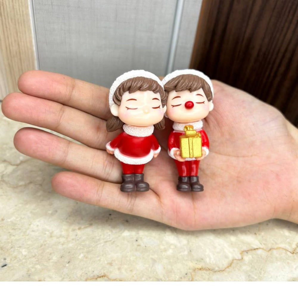 Christmas Couple Miniature Figurine Set - Cute Boy and Girl in Santa Outfits with Gift