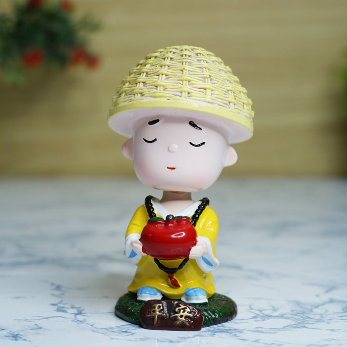 Wonderland Single piece Meditating monk with Apple shaking head| monk statue| home décor| gift articles | gift item