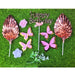 Clear plastic package containing a Rose Gold Butterfly Cake Topper Set with shiny metallic fan-shaped leaves and bright pink butterfly cutouts on sticks.