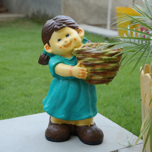 Decorative girl gardener statue in a teal dress holding a woven basket planter, resin outdoor garden figurine for patio and lawn decor.