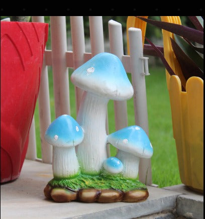 Resin mushroom garden décor in green