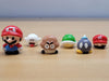 Set of six Super Mario character miniatures including Mario, Goomba, Boo, and Bob-omb, glossy resin video game collectibles for desk decor and fairy gardens.