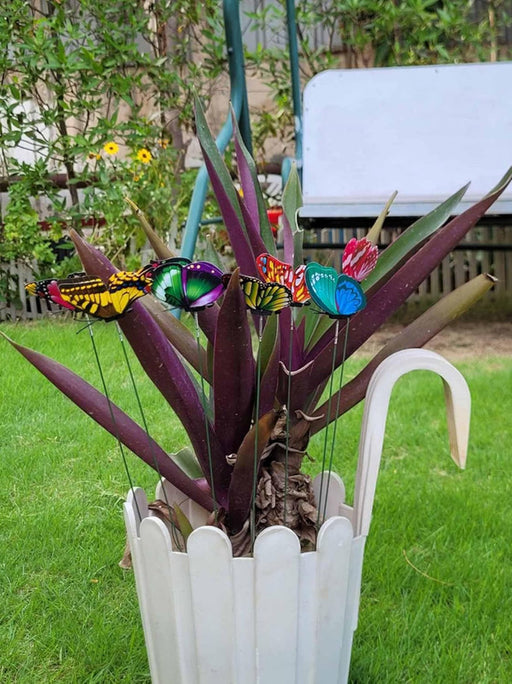 Attached to Flexible Wire Stems – Each butterfly is mounted on a bendable wire stake for easy positioning in soil, foam, or decorative arrangements.