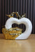 Modern abstract white heart ceramic sculpture with gold-plated birds and a textured metallic base, elegant romantic home decor centerpiece.