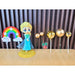 Cake topper set featuring a Princess Elsa doll figure, a rainbow arch, and several gold metallic sphere ornaments for a Frozen-themed birthday party.