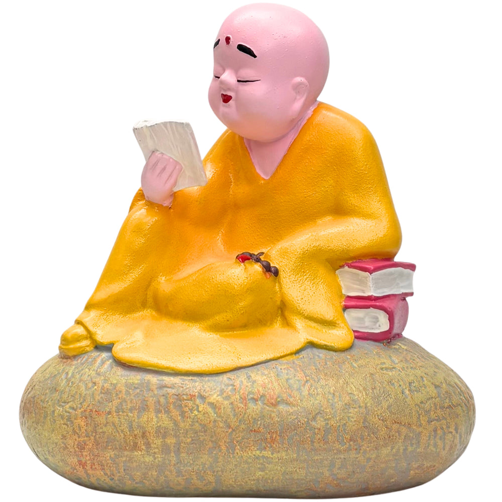 Zen Monk Figurine Reading on Stone