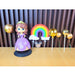 Princess Sofia inspired cake topper set in plastic packaging featuring a doll in a purple dress, gold disco balls, and a red "PARTY" bow header.