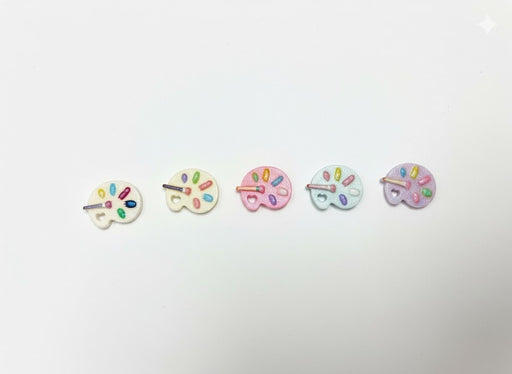 Five miniature pastel artist palette charms with colorful paint