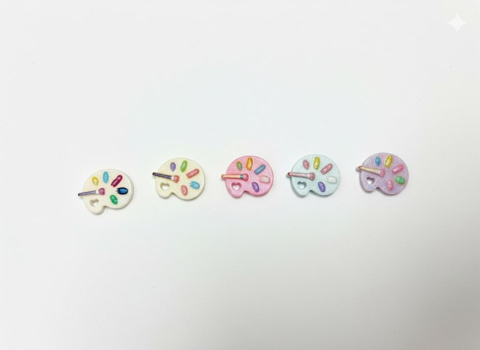 Five miniature pastel artist palette charms with colorful paint