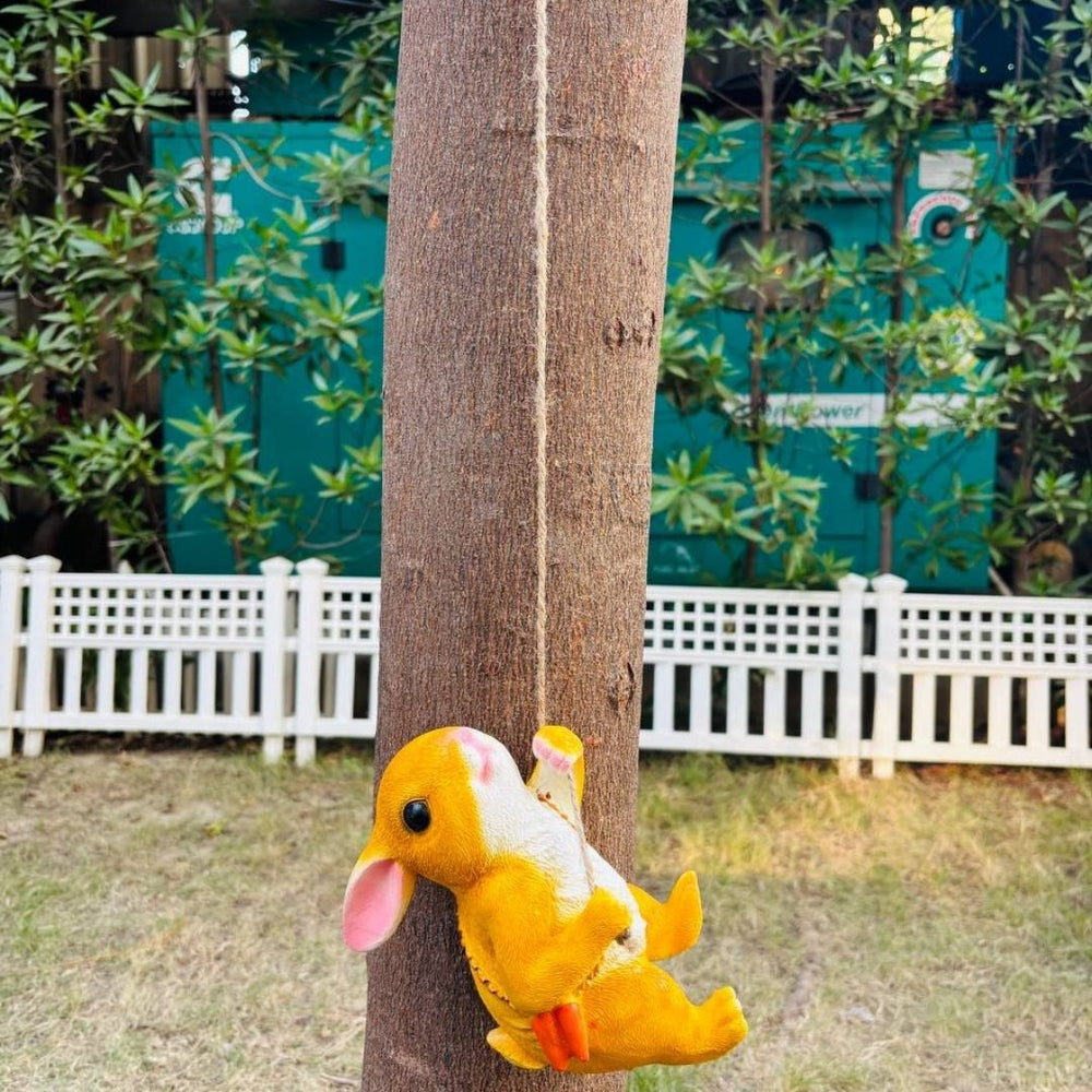Cute Orange Rabbit Garden Ornament Hanging on a Rope Swing
