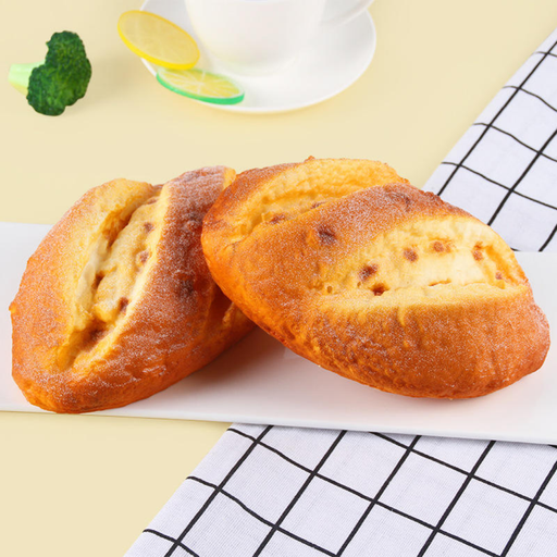 artificial milk bread prop with a realistic golden crust, flour dusting, and soft-touch texture for display.