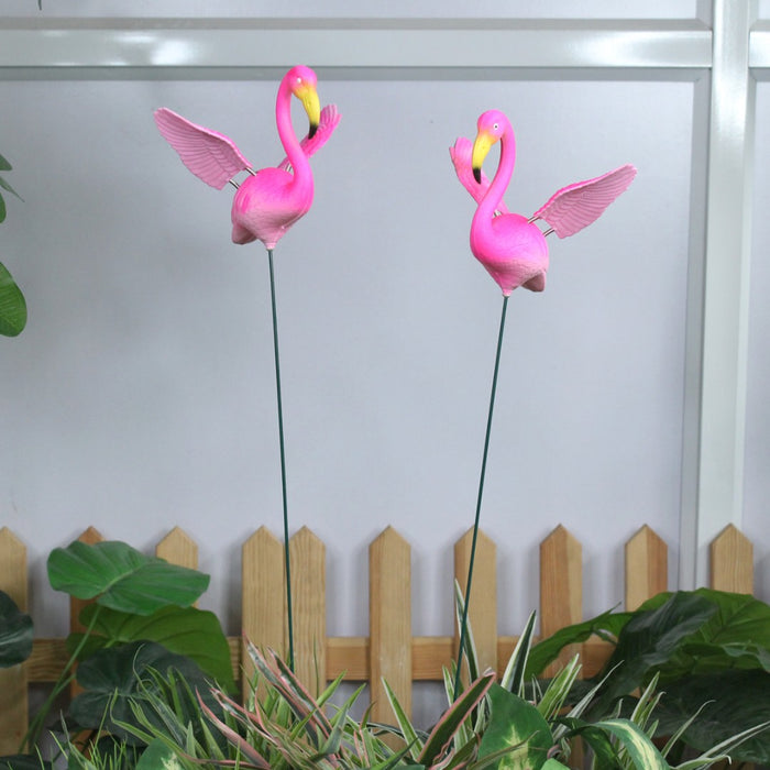Pink flamingo garden stakes with wings