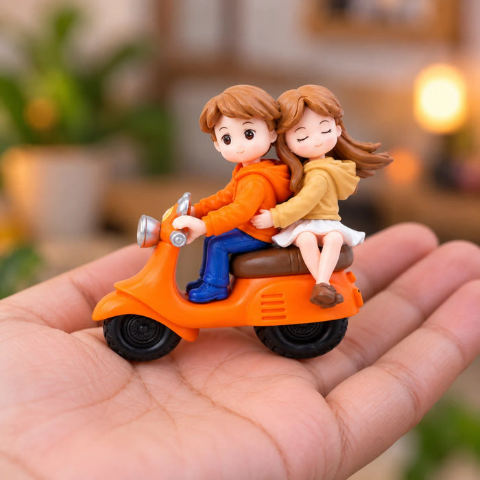 Cute Miniature Couple Riding an Orange Scooter Showpiece for Home Decor, Car Dashboard, and Romantic Gifting