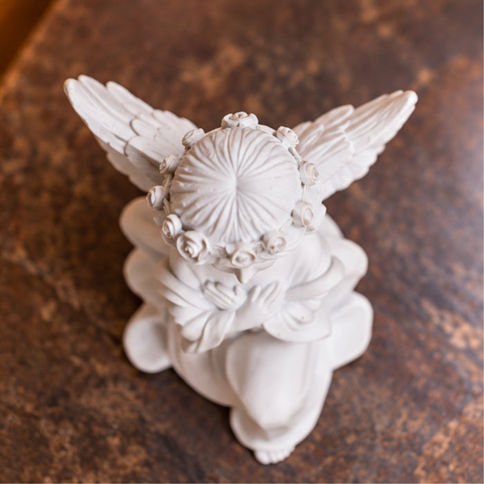 Angel big wings hand on heart, table decoration, home décor