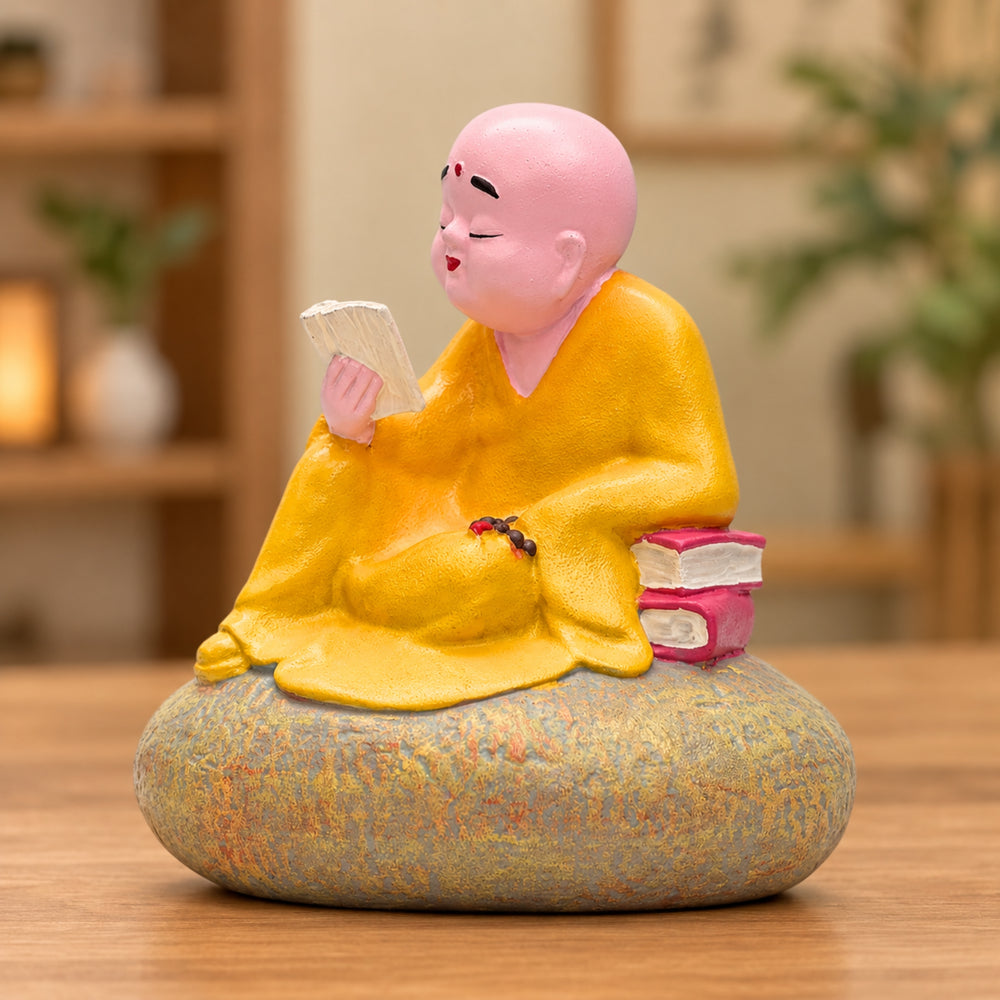 Zen Monk Figurine Reading on Stone