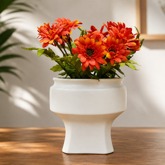 white ceramic planter pot displaying a modern geometric shape