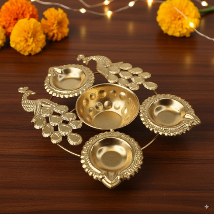 Wonderland 7 inch Gold Finish peacock urli with diya