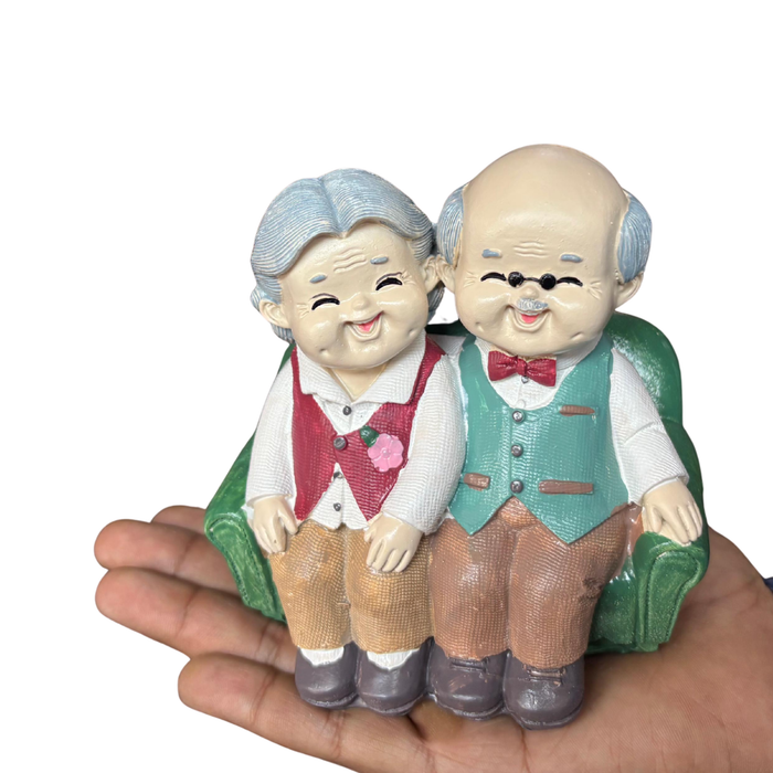 Wonderland Handcrafted Elderly Couple Figurine – "Forever Together" Loving Grandparents Statue on Green Sofa – Romantic Anniversary & Home Decor Gift-5.2x3.6x5.2 inch