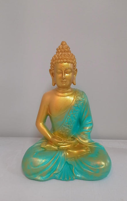 Seated Buddha statue in a meditative pose with gold and turquoise/teal finish.