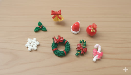 Christmas craft embellishments: tiny wreath, candy canes, bell, snowflake, holly leaf, Santa hat, and red bag