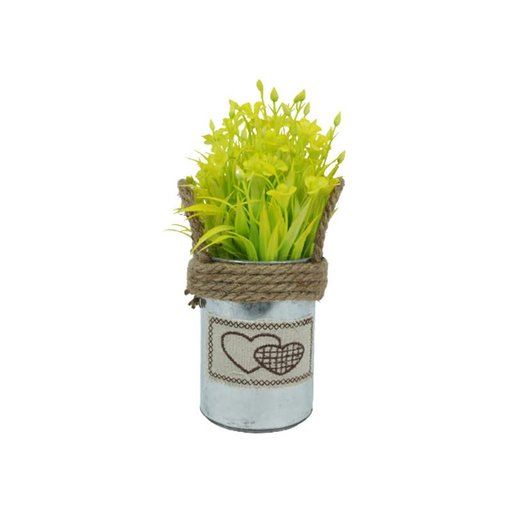 A small decorative tin pot featuring a fabric heart patch and rustic twine, filled with artificial yellow flowers.