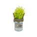 A small decorative tin pot featuring a fabric heart patch and rustic twine, filled with artificial yellow flowers.
