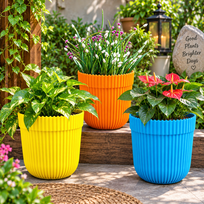 Set of 3 colorful ribbed plastic plant pots in yellow orange and blue, plants not included
