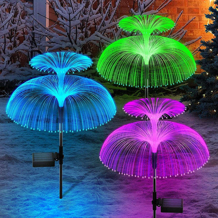 Set of 2 Wonderland solar garden lights with double-tier fiber optic jellyfish designs glowing in vibrant auto-changing colors