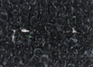 A high-angle, detailed close-up of a large collection of artificial miniature black roses arranged in a dense pattern.