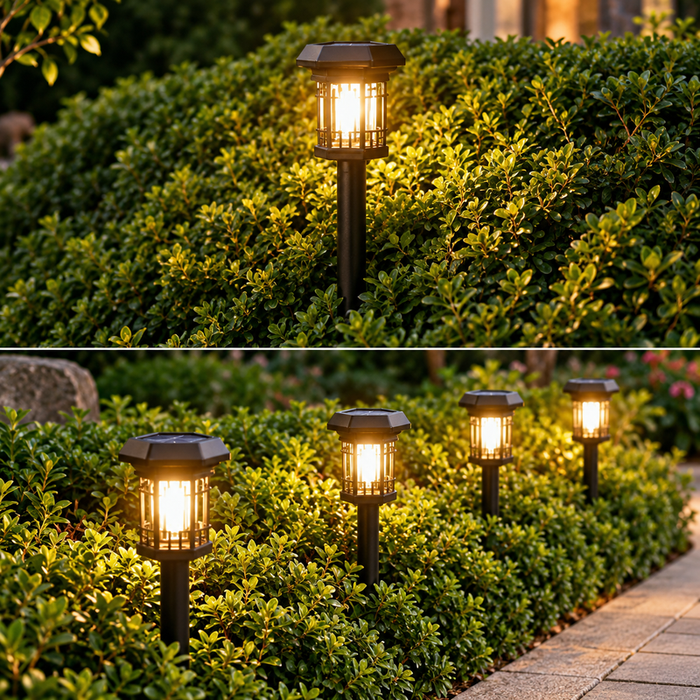 Four vintage-style solar pathway lights glowing brightly along a garden path during rainfall