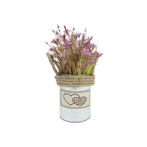 A small decorative tin pot featuring a fabric heart patch and rustic twine, filled with artificial purple flowers.