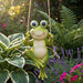 Green frog garden statue sitting on a rope swing hanging in a garden surrounded by hostas and pink and purple flowers.